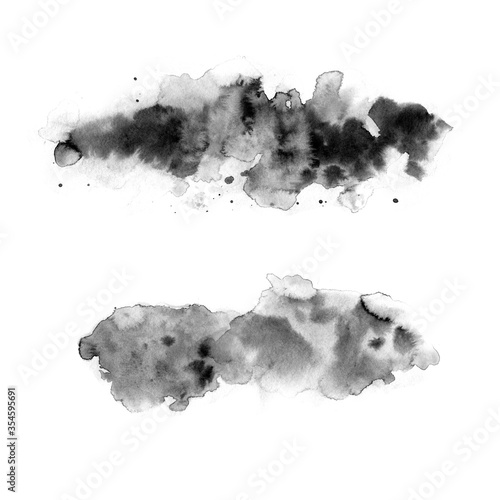 Black watercolor stains on a white background. Abstract painting  naive art. Splashes of ink.