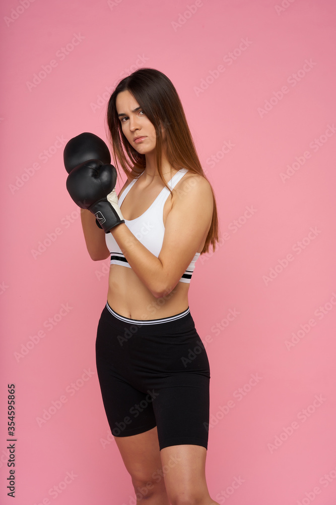 young girl doing fitness on pink background
young girl doing fitness on pink background