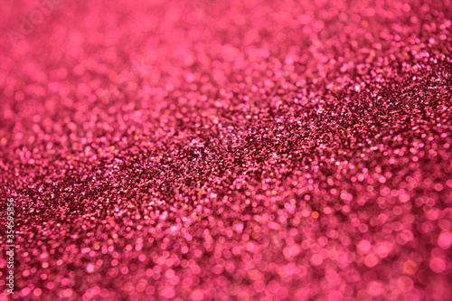 Hot and Bright Pink Glitter Lights Background. Shine Bokeh Effect.