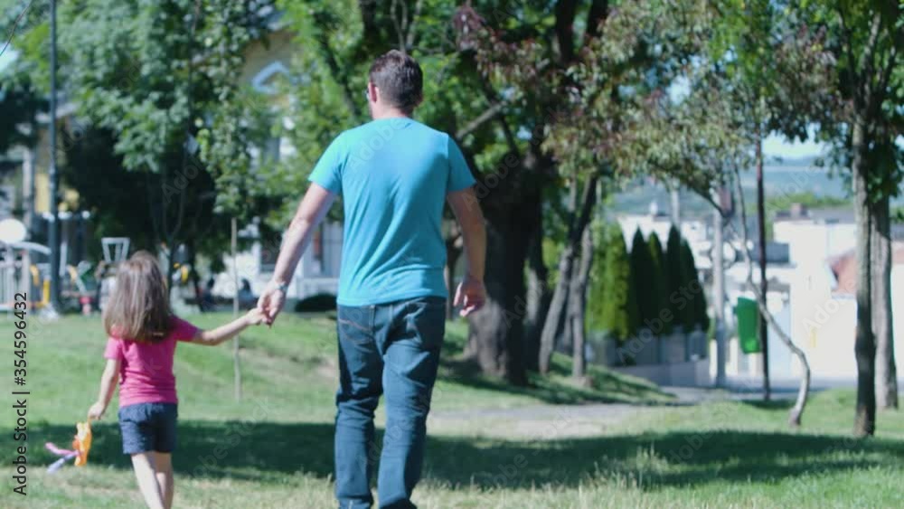 Father and daughter holding hands in slow motion Father and daughter holding hands in slow motion