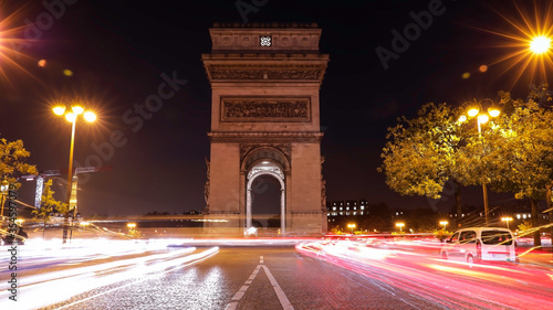 Long exposurein the night at Champs-Elysees and Arc de Triomphe at night in Paris, France