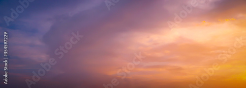 Beautiful dark orange sky evening beauty and Clouds at sunset , Panoramic scene view . Natural background  © Ayman