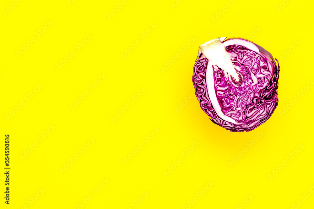 Red cabbage - head, cross section - on yellow background top view copy space Red cabbage - head, cross section - on yellow background top view copy space