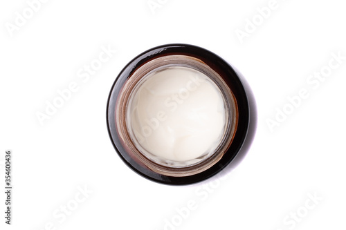 Cream in a jar isolated on white background. Top view.