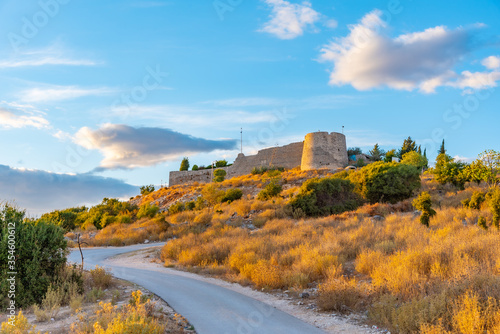 Sunset view of Lekuresi castle at Sarande, Albania photo