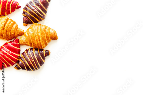 Set of croissants - chocolate, berry, classic - on white background top view © 279photo