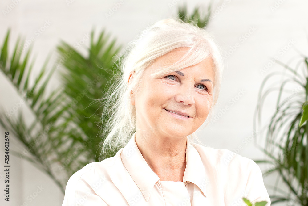 Portrait of smiling beautiful senior lady at home. Portrait of smiling beautiful senior lady at home.