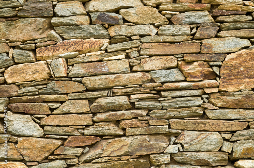 Obraz premium Old colorful stone wall closeup