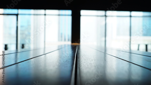 an architectural view with a blurred view at the back. The foreground of the table is clear