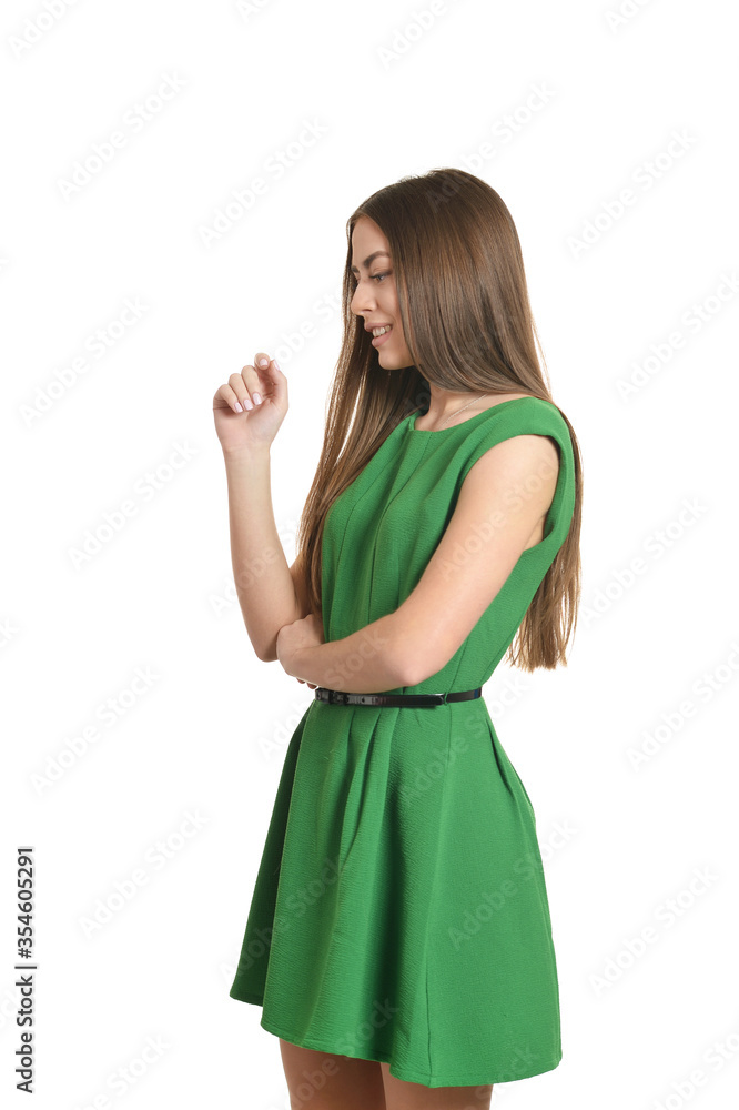 Beautiful woman posing in green dress on white background Beautiful woman posing in green dress on white background
