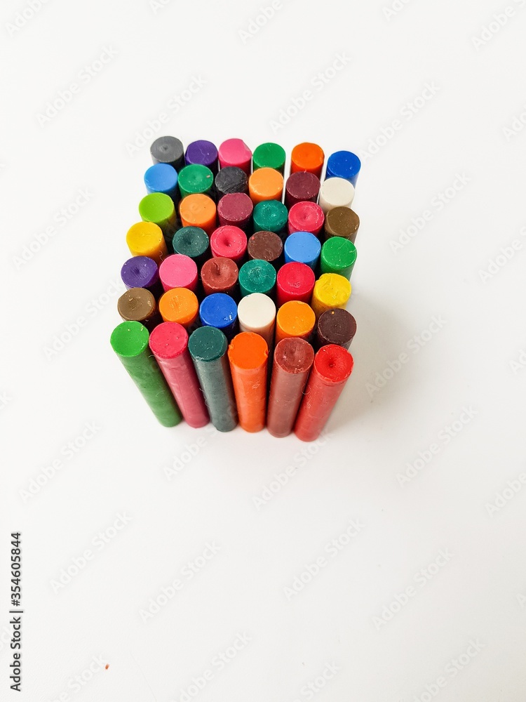 Cube of colored chalk pencils on a white background. Cube of colored chalk pencils on a white background.