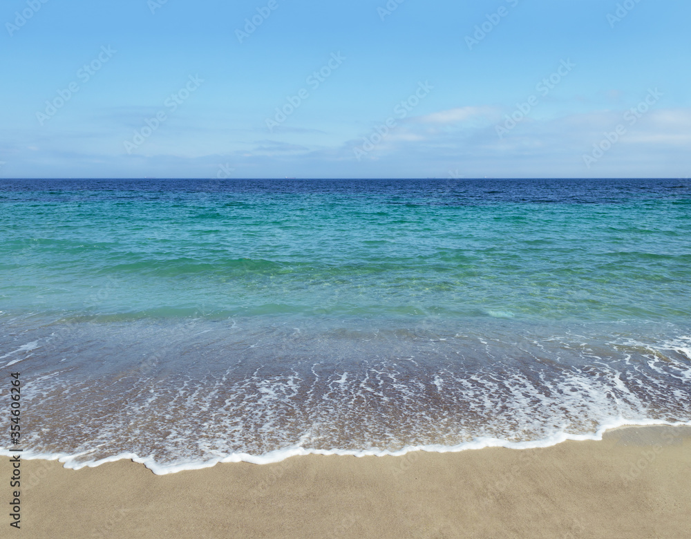 Surf and sand on beach on Black Sea