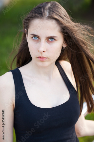 Young woman in summer park © Andrey_Arkusha