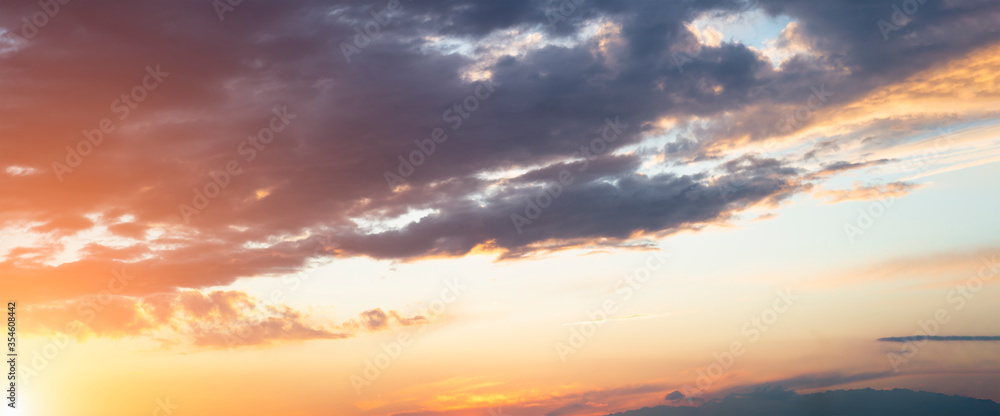 Evening sky with sun flare. Long poster or banner.