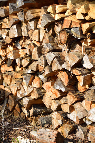 Firewood piled up outside in winter