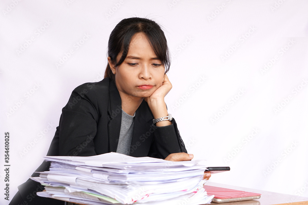 Office worker Bored When seeing a lot of paperwork Office worker Bored When seeing a lot of paperwork