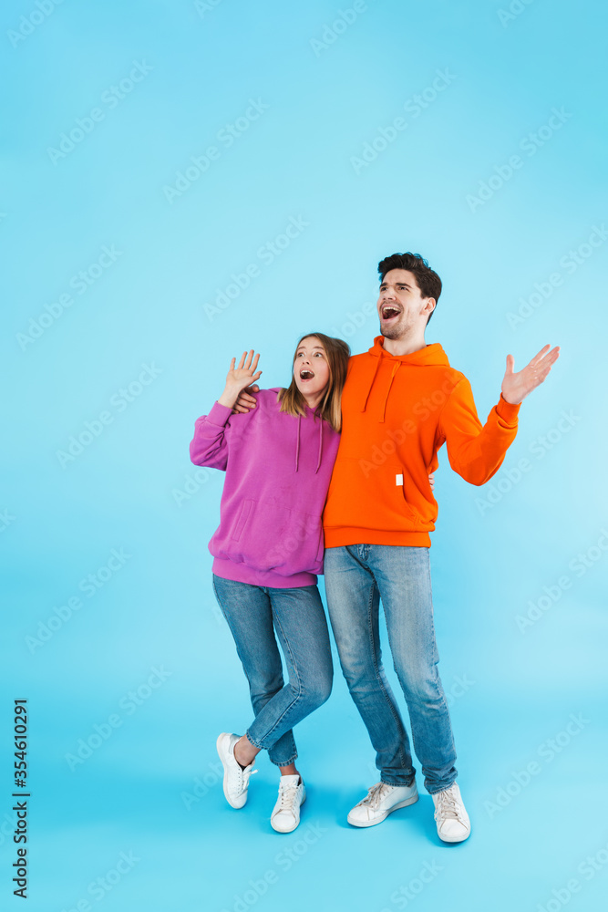 Portrait of a young couple wearing hoodies Portrait of a young couple wearing hoodies
