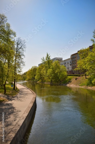 Svisloch river in Gorky park in Minsk, Belarus. Sunny summer day in entertainment park