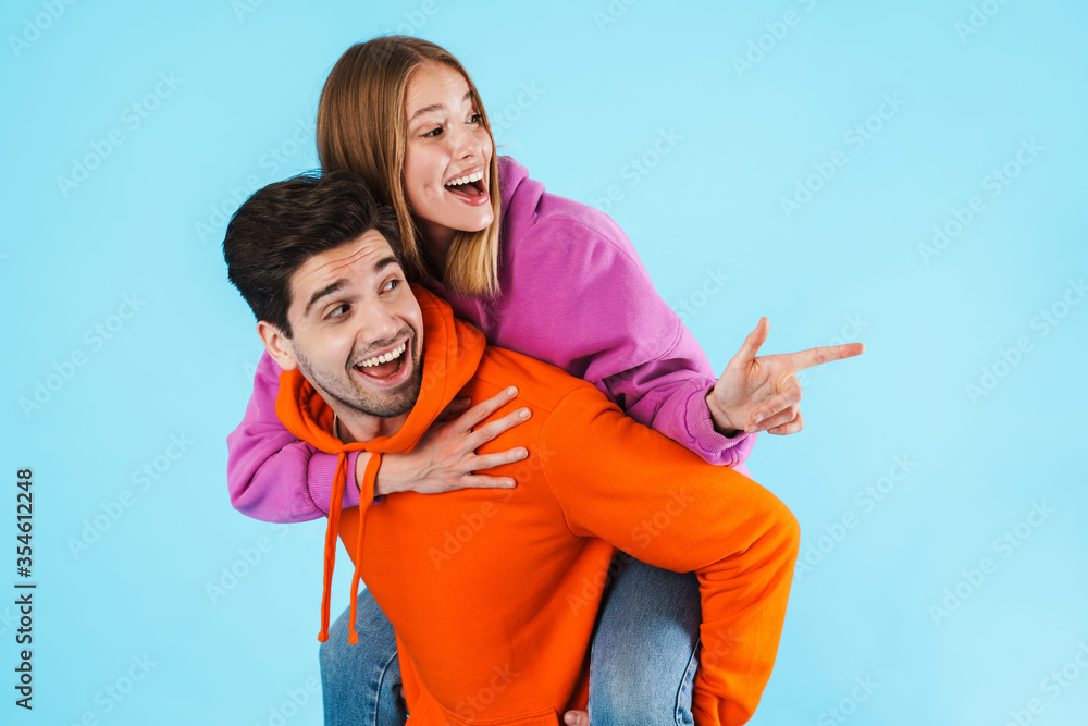 Fototapeta premium Portrait of a young couple wearing hoodies