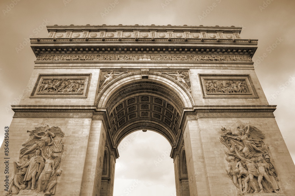 Paris Triumphal Arch. Sepia toned vintage filter photo.