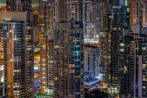Dubai Marina modern cityscape at night. Concrete jungle
