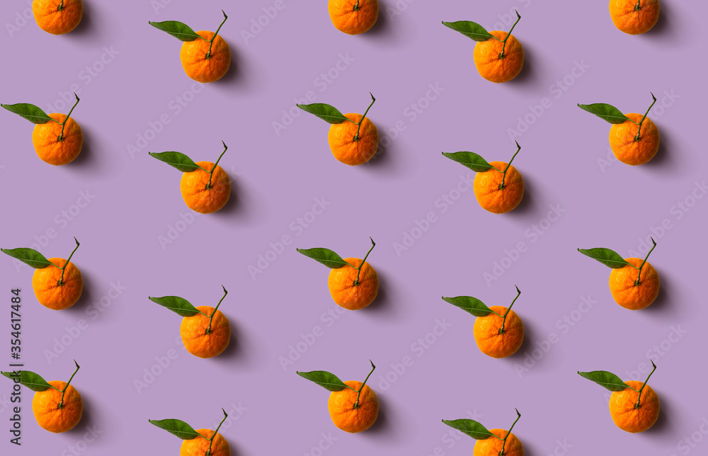 Fototapeta premium Mandarin pattern isolated on soft pastel background. Fresh fruit.