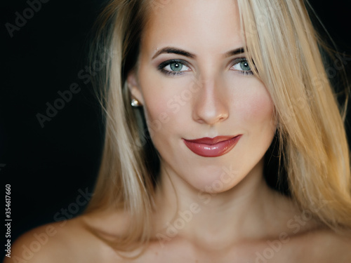 Portrait of beautiful sensual woman with green eyes. Studio shot.