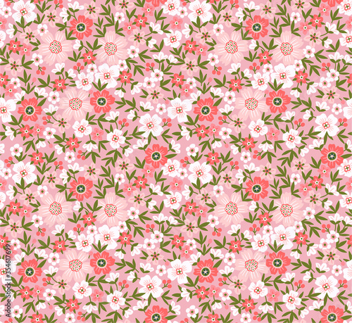 Seamless floral pattern for design. Small pastel colours flowers. Coral background. Modern floral texture. A allover floral design in light colors. The elegant the template for fashion prints.