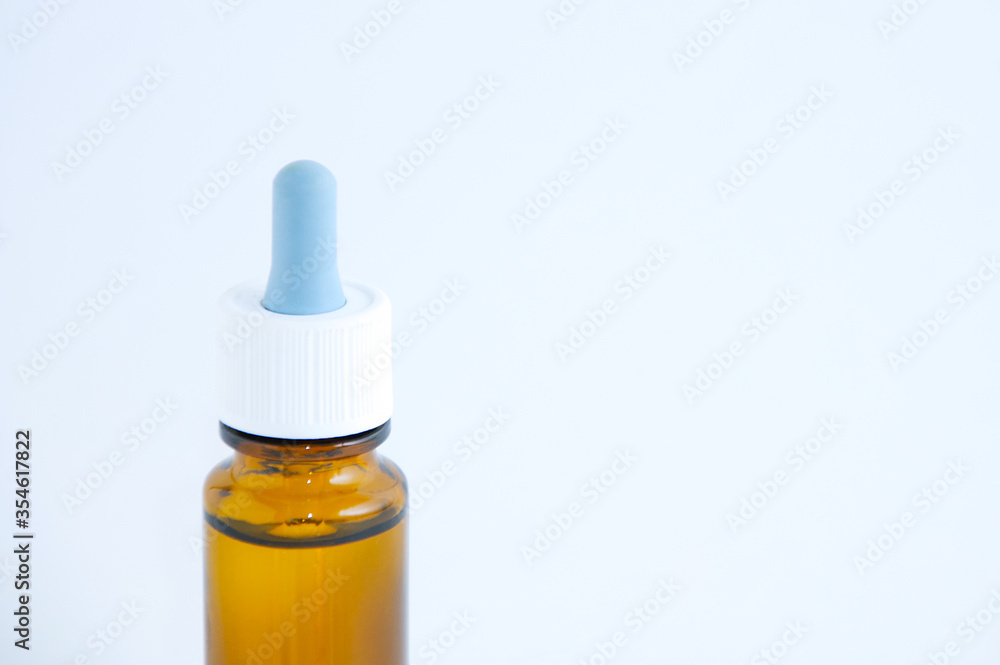 Nasal drops with brown glass bottle on a white background. Nasal drops with brown glass bottle on a white background.