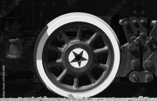 Old wheel with star of a Soviet military steam locomotive