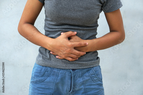 Woman has stomachache,menstrual period cramp, abdominal pain, food poisoning