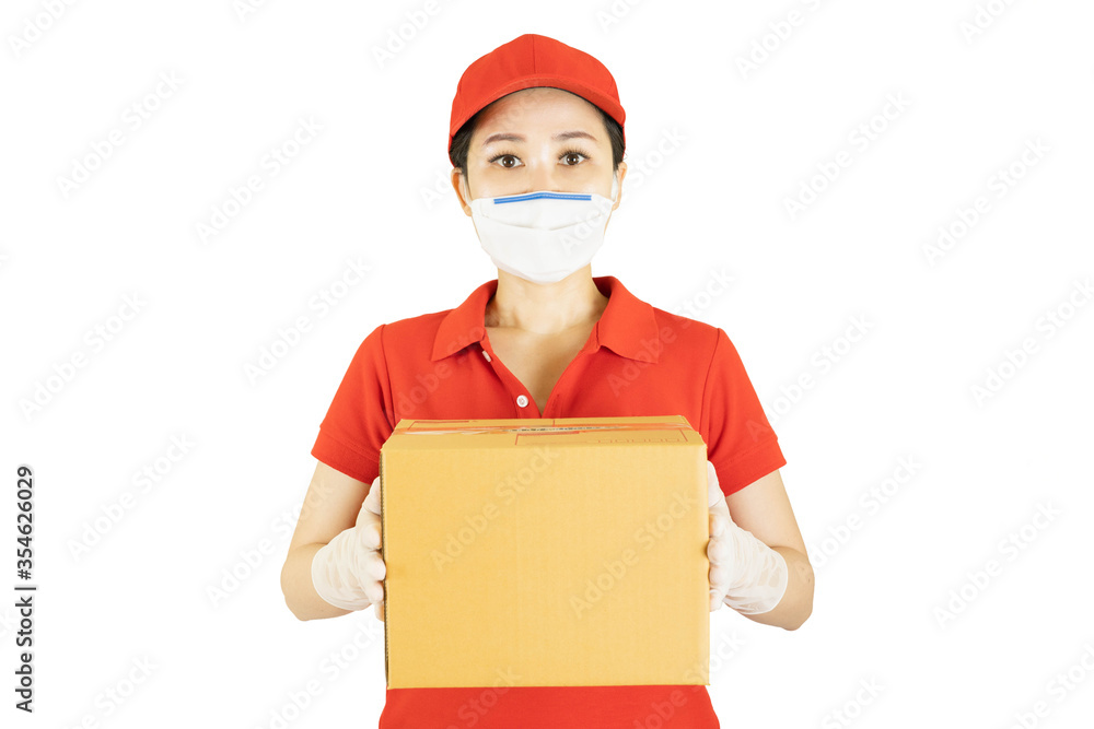 Delivery woman in red uniform isolated on white background.Courier in protective mask and medical gloves holding cardboard box. Receiving package under quarantine, disease outbreak