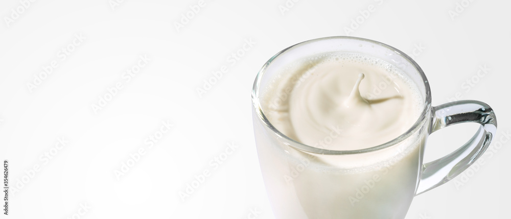 Drops of milk in a clear glass with clipping path. Drops of milk in a clear glass with clipping path.