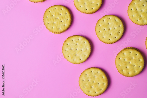 Sandwich cookies on pink background. Trendy minimal food. Simple bakery, top view