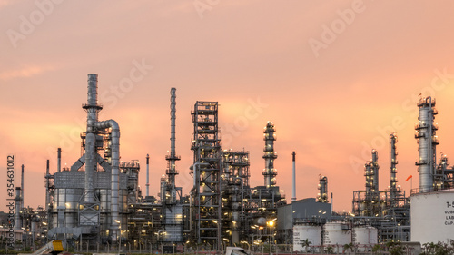 Aerial view by drone of oil petrochemical refinery plant during sunset time