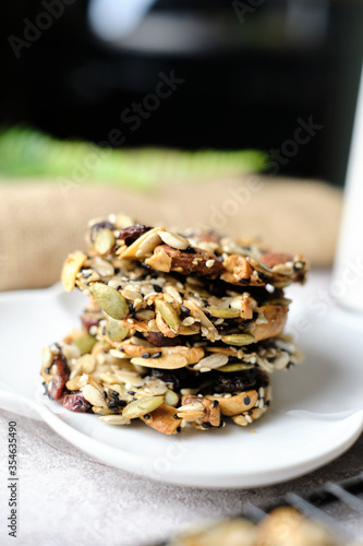 Mixed Nut and Dried fruits and Seeds Florentine, Gluten free whole foods Healthy biscuit cookies. set on cafe table. photo