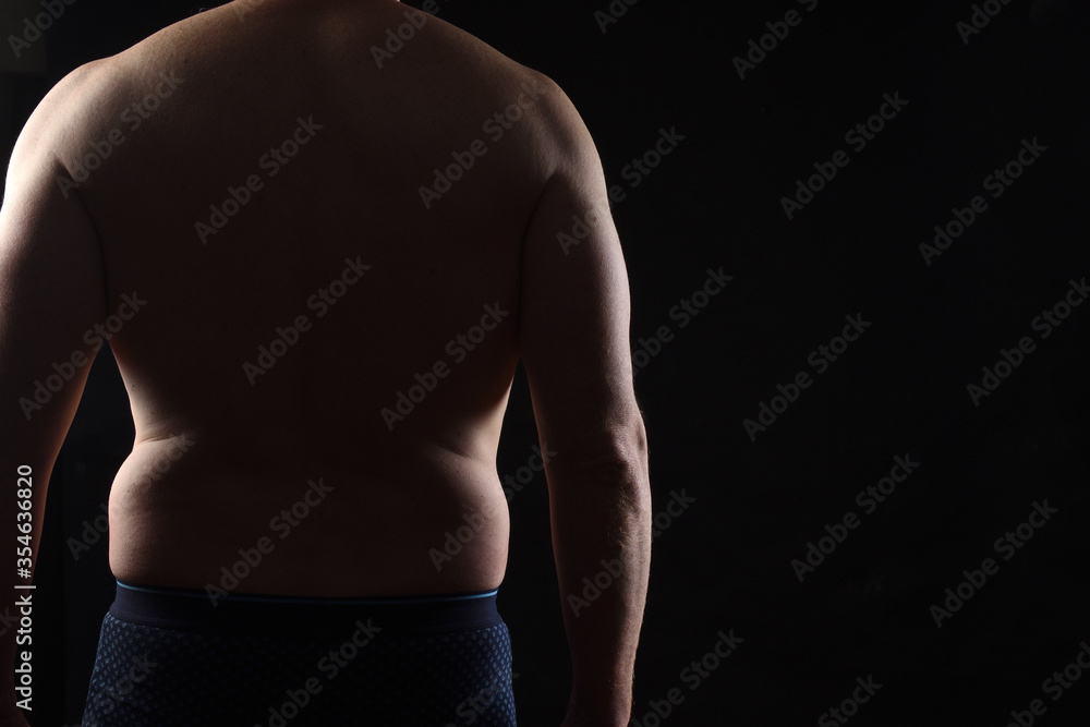body of a real man man on black background, rear view body of a real man man on black background, rear view