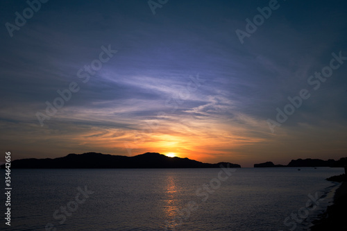 The colorful sunset sky at the top of the mountain by the sea