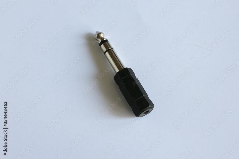 headphone plug with cap on a white table headphone plug with cap on a white table