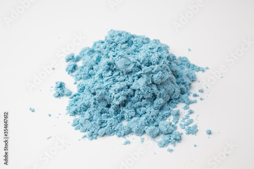 Kinetic blue sand on white background
