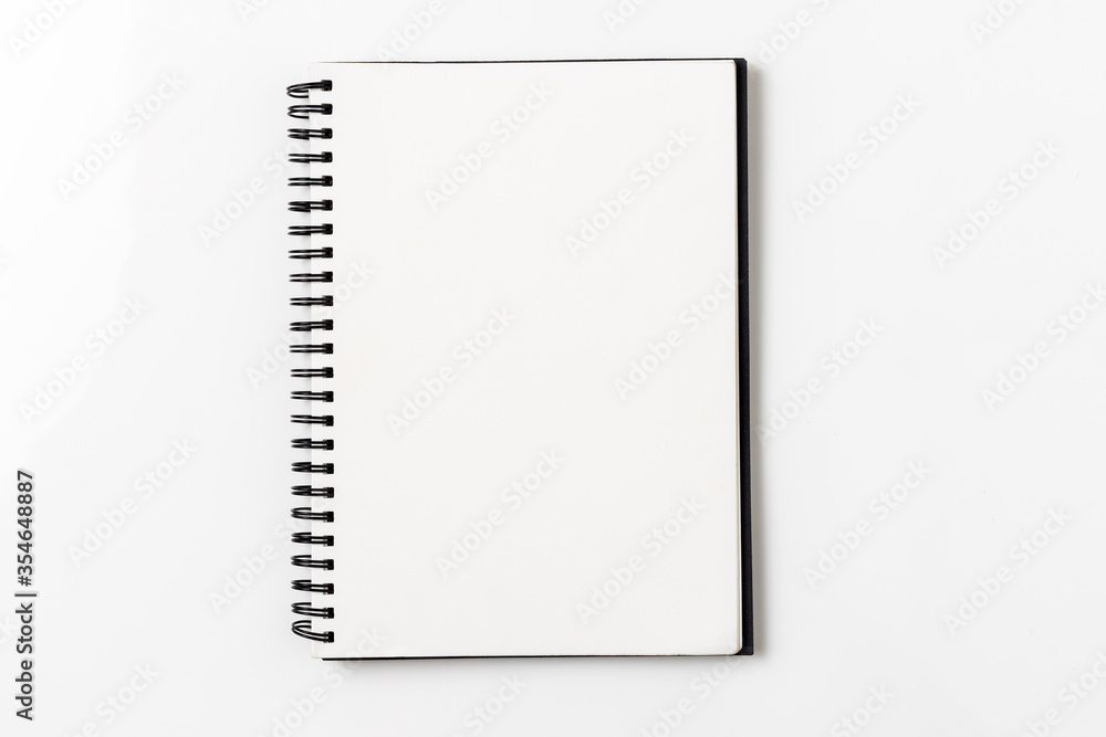 Top view, empty notebook on a white background. Top view, empty notebook on a white background.