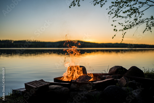 bonfire in front of lake photo