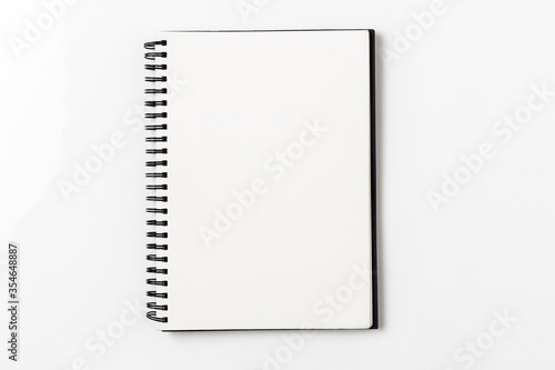 Top view, empty notebook on a white background.