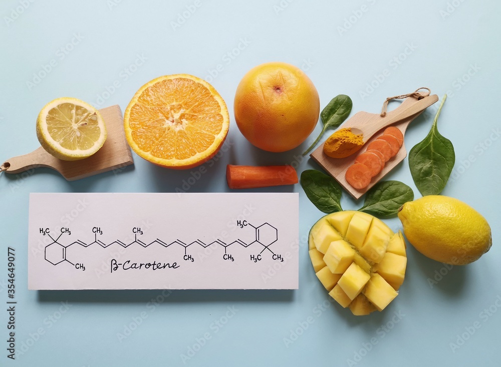 Fotka „Food rich in beta carotene with structural chemical formula of