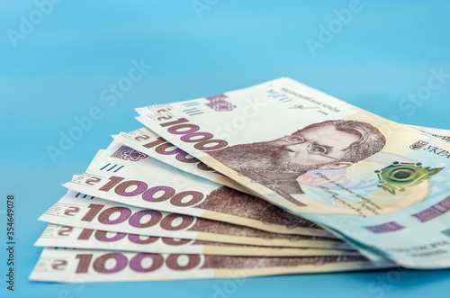 UAH. Money of Ukraine 1000 hryvnia, Ukrainian banknote isolated on blue background