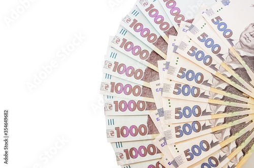 new 1000 and 500 hryvnia isolated on a white background. A lot of hryvnia. Close-up. Copy space. Place for text. © Tania