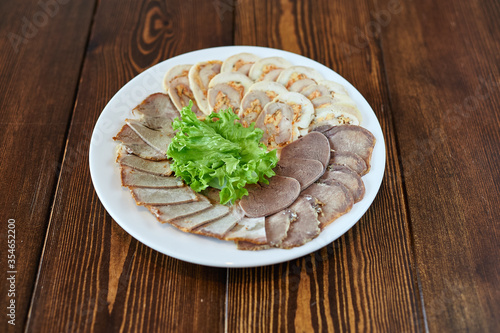 A plate of food sitting on top of a wooden table