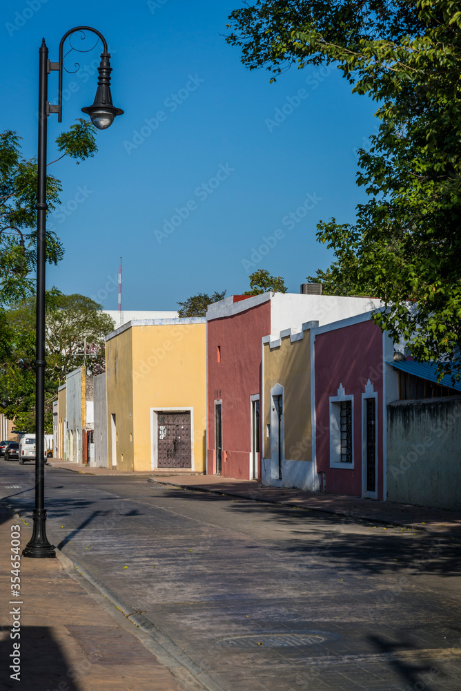 Typical street with beautiful pastel-painted houses, Valladolid, Yucatan, Mexico