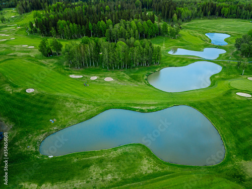 Aerial view of green grass at golf course in Finland