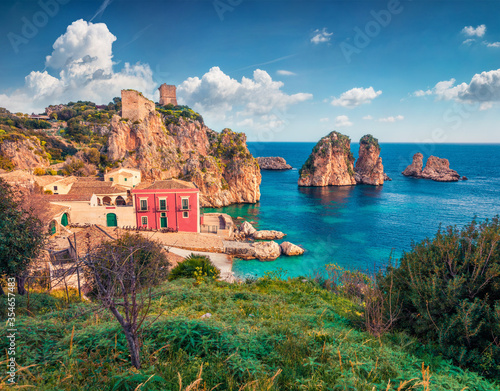 Picturesque summer view of Tonnara di Scopello. Beautiful landscape of Sicily, Italy, Europe. Calm morning seascape of Mediterranean sea. Traveling concept background. photo